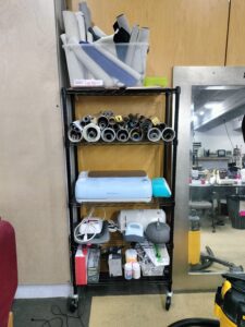 Shelves containing cricut materials